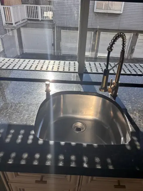 Sparkling kitchen sink after post-construction cleaning